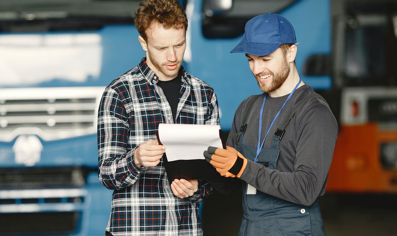 info-10 An equipment sales person hands their customer a lease to own application