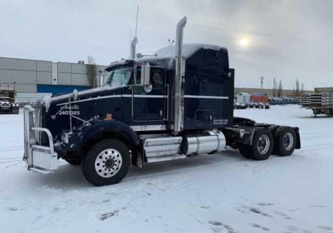 A semi-truck in the snow.